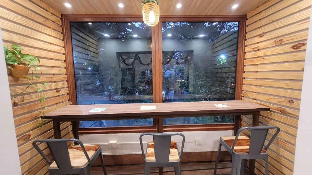 White-framed casement windows in a cafe interior